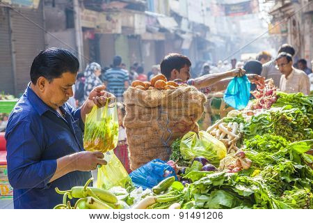 Man Sells Bananas At The Old Vegetable Street Market In Delhi