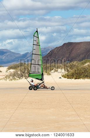 Corralejo, Fuerteventura, Spain - Spetember 15, 2015: People Driving Sand Yachting On The Beach. The