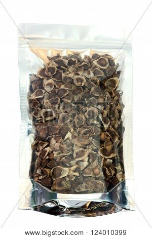 Dried Moringa Seeds in packaging foil zip lock bag. Isolated on white with clipping paths. food ingredient. Substitute drug treatment for skin hydration.
