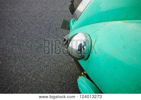 light blue autobike parking on bituminous macadam