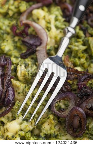 fork on a bavarian spinach spaetzle pasta dish
** Note: Shallow depth of field