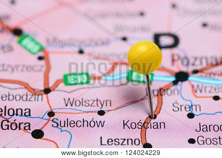 Photo of pinned Koscian on a map of Poland. May be used as illustration for traveling theme.