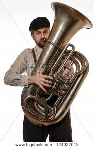 beard man with suspenders and cap holding the tube