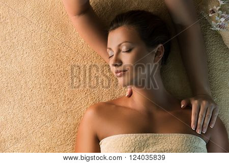 The beautiful girl has relaxing massage. Spa treatment