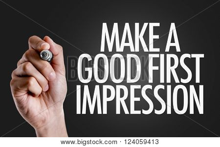 Hand writing the text: Make a Good First Impression