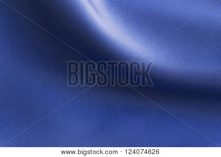 Shiny Blue silky fabric folds background texture