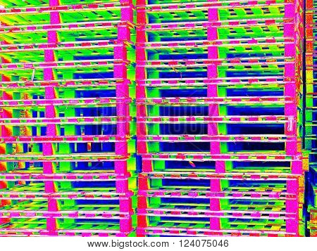 Outside stock of old manufactured wooden euro pallets in thermography scan.