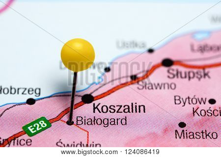 Photo of pinned Bialogard on a map of Poland. May be used as illustration for traveling theme.
