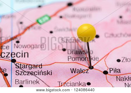 Photo of pinned Walcz on a map of Poland. May be used as illustration for traveling theme.