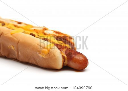 A chili dog with cheese on a white background