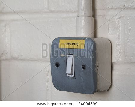 Light switch with exposed cable conduit on painted brick wall
** Note: Visible grain at 100%, best at smaller sizes