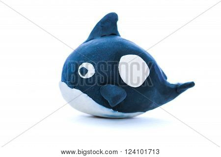 Black whale model from clay. Isolated on white background. Studio shot.