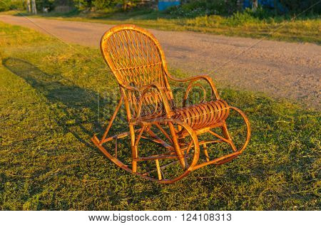 Wicker rocking-chair is waiting for the holiday-maker