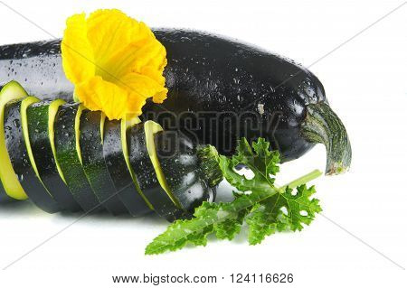 Courgette Cut Into Slices And Leaves On White
