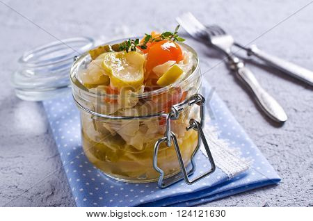 Homemade canned vegetables in the marinade. Selective focus.
** Note: Shallow depth of field