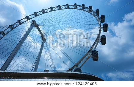Singapore, Singapore - April 2, 2015: Ferris wheel Singapore Flyer at Marina Bay. The Flyer has an overall height of 165 metres and was opened in 2008.