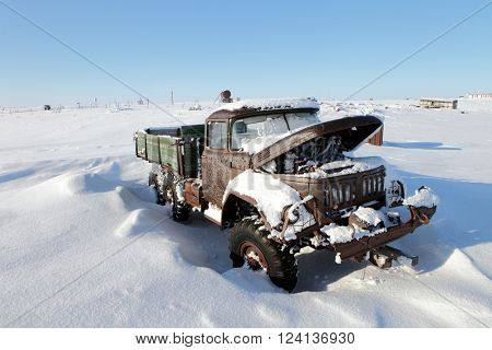 VIZE ISLAND, RUSSIA ?? APRIL 14, 2015: Abandoned truck in winter Arctic