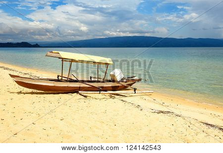 Boat on Siuri beach at Poso lake. Central Sulawesi. Indonesia