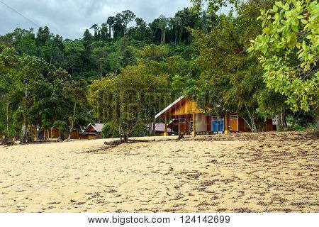 Wooden bungalows on Siuri Beach at Poso lake. Central Sulawesi. Indonesia