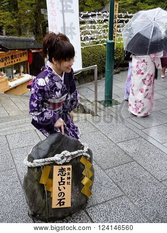 KYOTO JAPAN - APRIL 16 2010: Cute Japanese girl in a national kimono