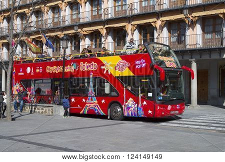 TOLEDO SPAIN - MARCH 23 2016: Touristic bus in Toledo Spain. Toledo City Tour is a touristic bus service that shows the city with an audio guide.