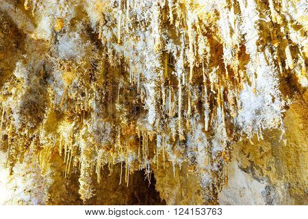 Many White Stalactites Inside Of Cave