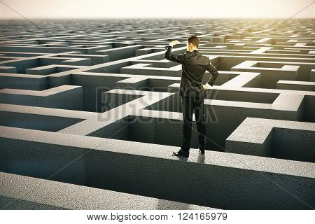 Solution concept with businessman looking into the distance standing on maze wall. 3D Rendering