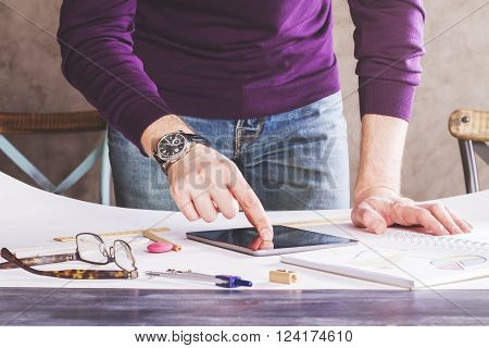 Male Using Tablet On Whatman