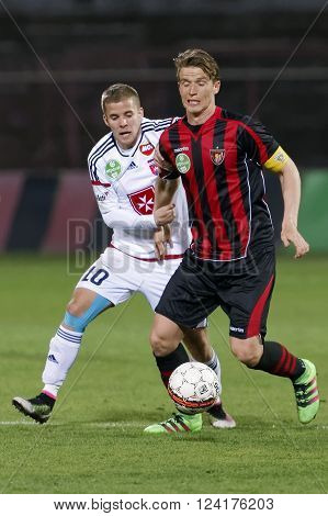 BUDAPEST, HUNGARY - APRIL 2, 2016: Patrik Hidi of Honved (r) and Istvan Kovacs of Videoton during Budapest Honved - Videoton OTP Bank League football match at Bozsik Stadium.