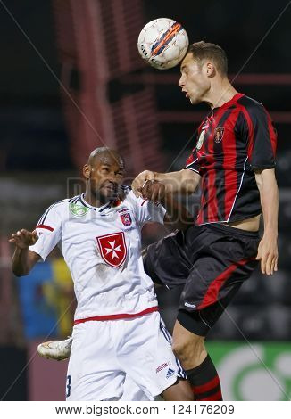 BUDAPEST HUNGARY - APRIL 2 2016: Air battle between Marton Eppel of Honved (r) and Paulo Vinicius of Videoton during Budapest Honved - Videoton OTP Bank League football match at Bozsik Stadium.
