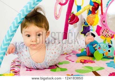 Baby Girl Palying In An Activity Gym