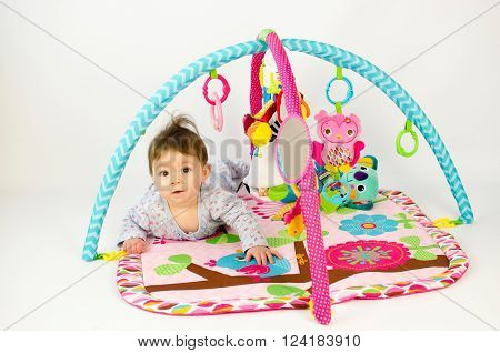 Baby Girl Palying In An Activity Gym