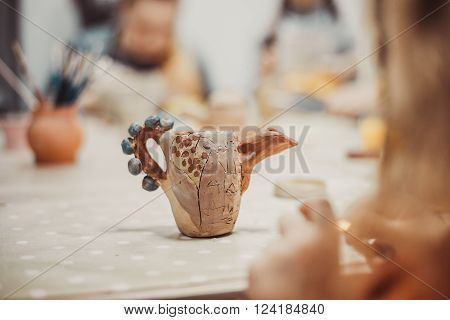children's hands sculpts clay crafts pottery school