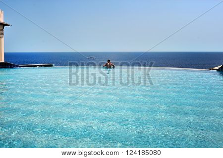 pool and sea view iwith man. Egypt