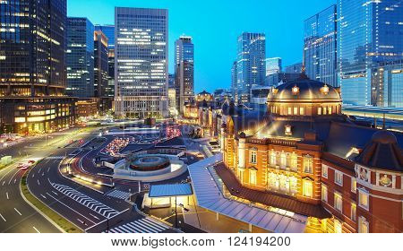 Tokyo railway station and Tokyo highrise building at twilight time
