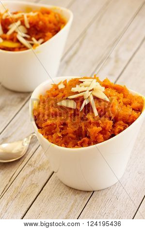 Carrot halwa - Diwali sweet made of carrots milk and sugar in white bowl