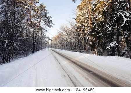 Photographed Road In The Winter. Winter, The Road Is Covered With Snow