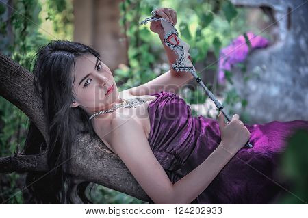 portrait of asia women with mask on nature canival concept