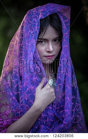 portrait of asia women with mask on nature canival concept