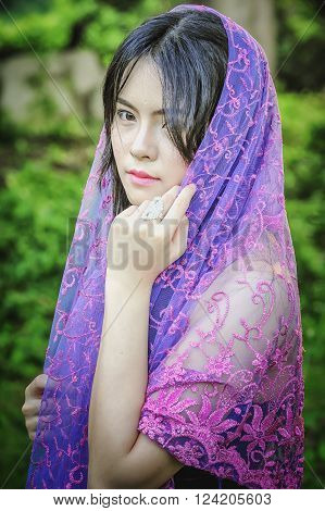 portrait of asia women with mask on nature canival concept