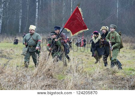 GATCHINA, RUSSIA - NOVEMBER 07, 2015: A detachment of Petrograd workers in the attack, the international military-historical festival "the Civil war in Russia. Northwest, 1919"