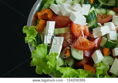 Ready Greek salad beautifully decorated on the table