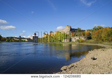 Sunny september day on the river Narova. View of the Ivangorod fortress and the castle of Hermann