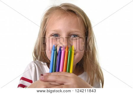 6 or 7 years old beautiful little girl holding multicolor crayons set isolated on white background
** Note: Soft Focus at 100%, best at smaller sizes