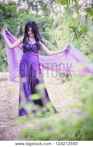 portrait of asia women with mask on nature canival concept