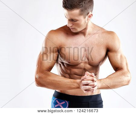 Bodybuilder Man Posing, Showing Perfect Abs, Houlders, Biceps, Triceps, Chest