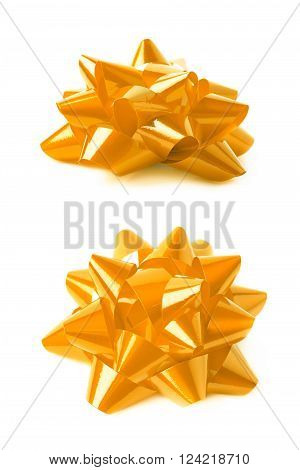 Decorational yellow ribbon gift bow isolated over the white background, set collection of two diffirent foreshortenings