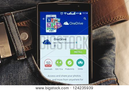 SARANSK, RUSSIA - April 3, 2016: Photo of Smartphone in a jeans pocket with OneDrive application in a Google Play Store on the screen.