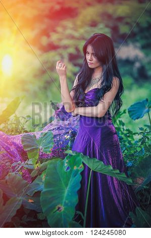portrait of asia women with mask on nature canival concept