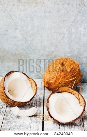 Fresh Coconuts In The Shell On A Blue  Wooden Background
